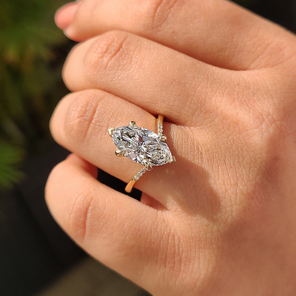 Gold Marquise Engagement Ring With Tapered Shank Band