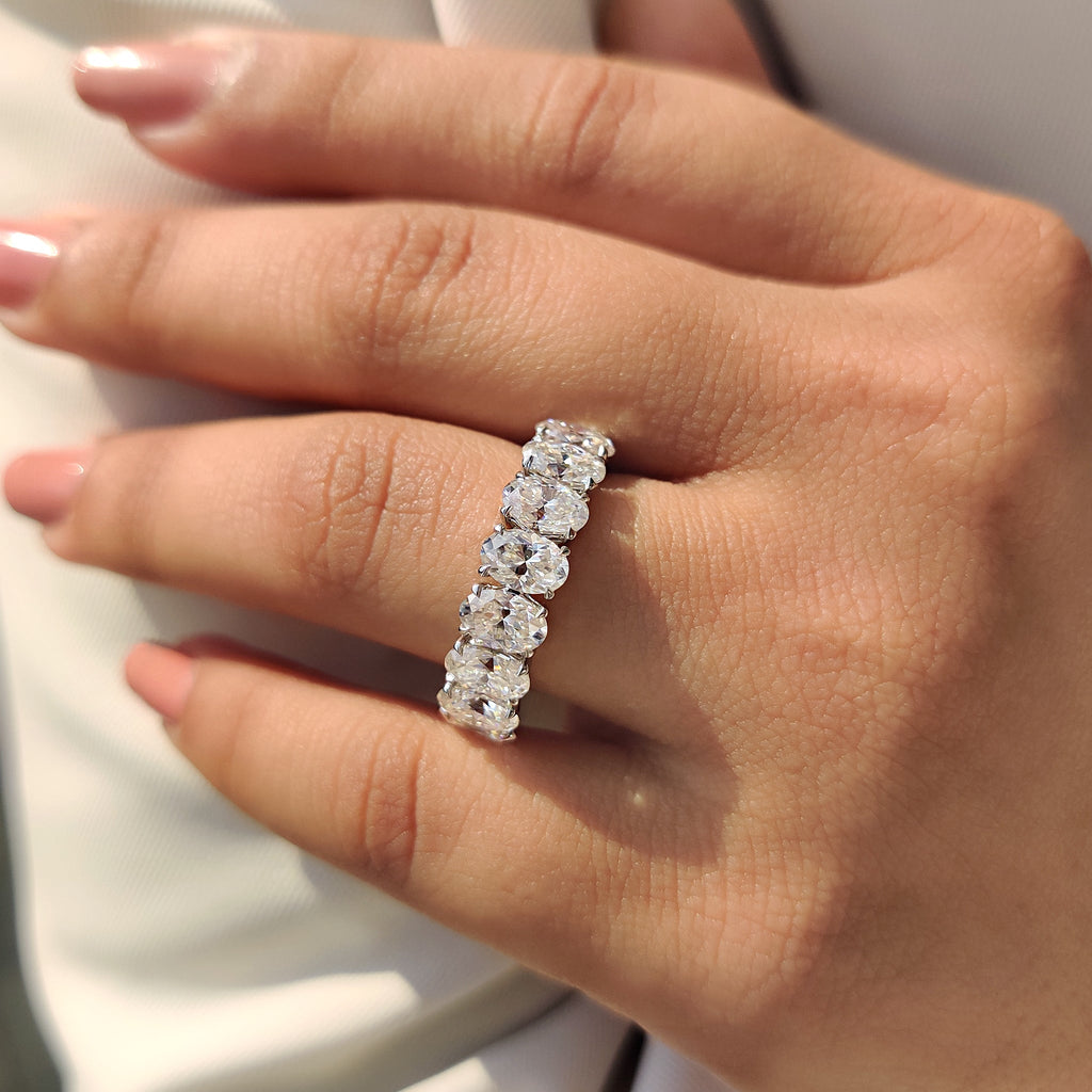 Oval Moissanite Wedding Band In Half Eternity Design