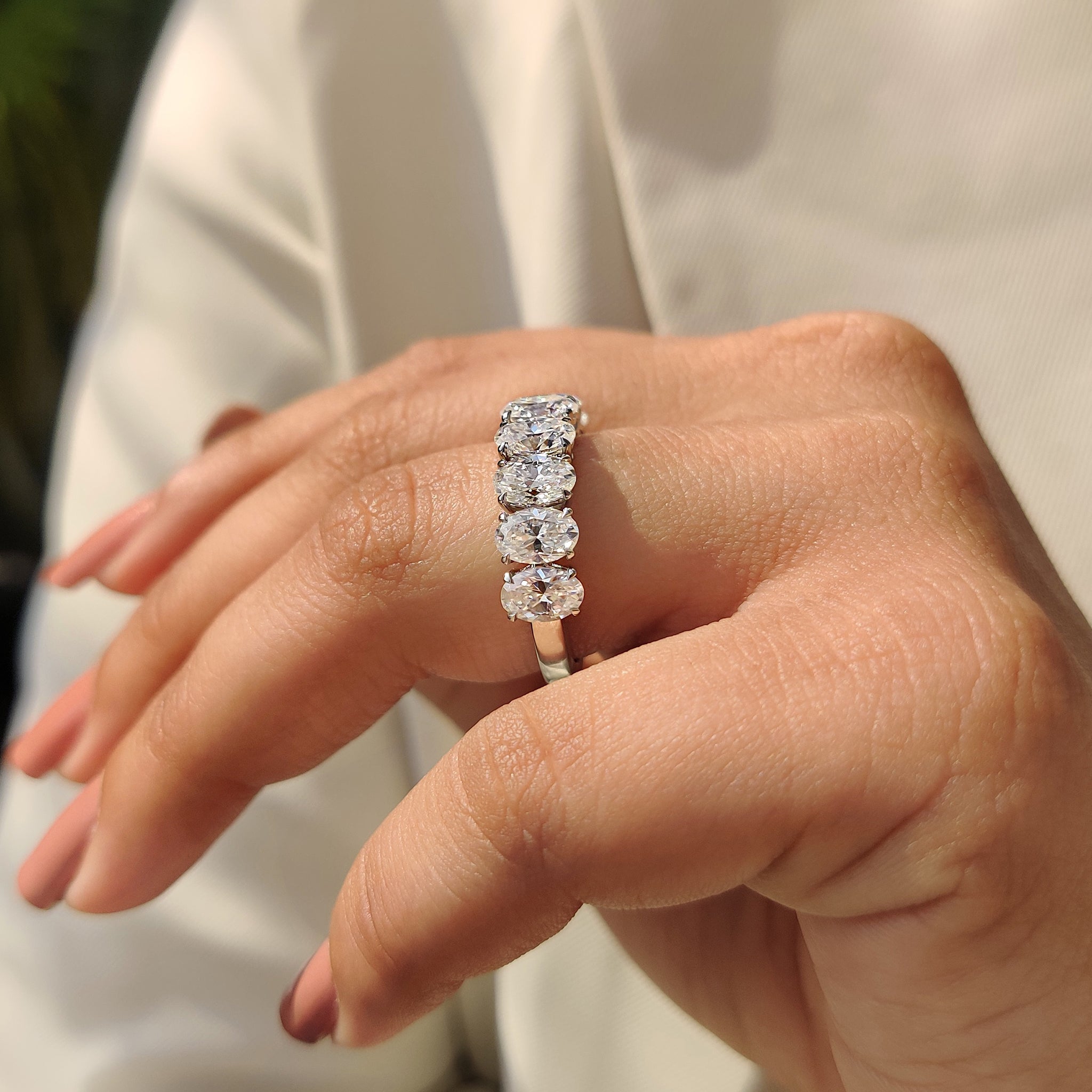 Oval Moissanite Wedding Band In Half Eternity Design