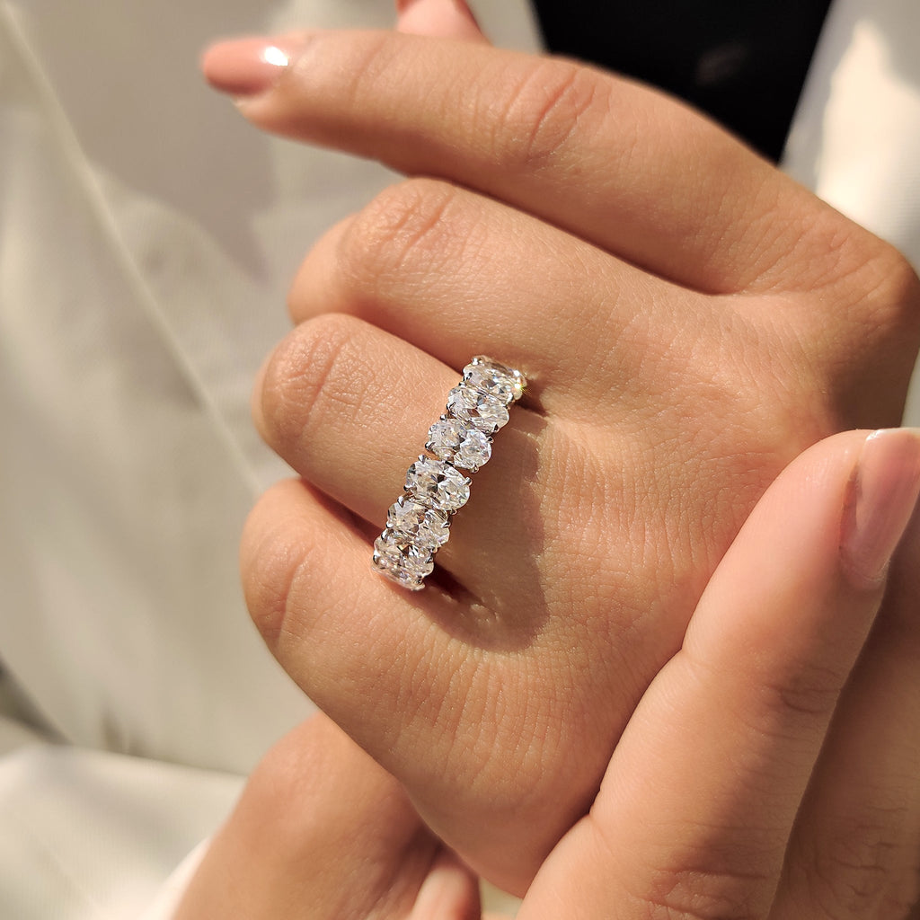Oval Moissanite Wedding Band In Half Eternity Design