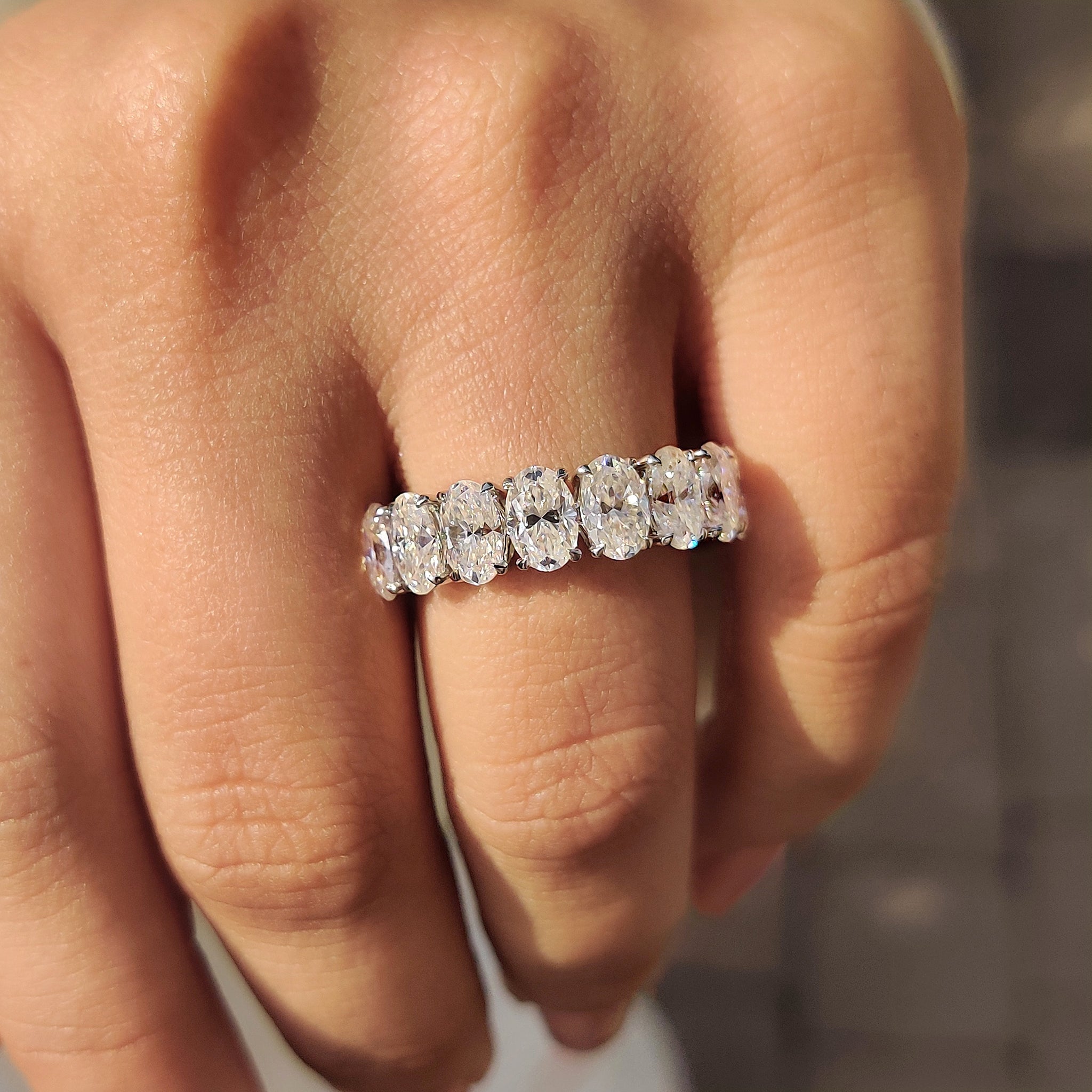 Oval Moissanite Wedding Band In Half Eternity Design