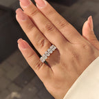 Oval Moissanite Wedding Band In Half Eternity Design