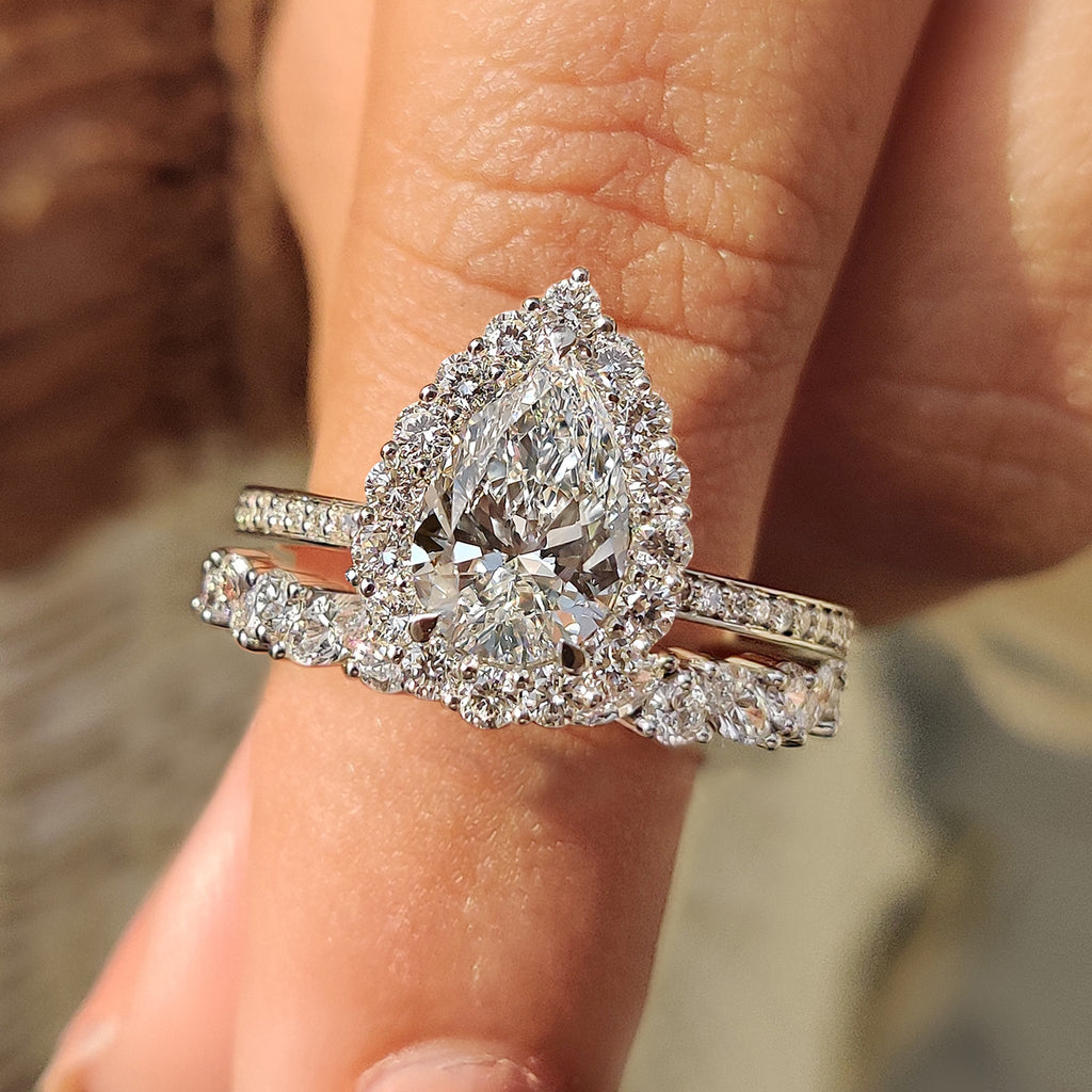 Pear Shaped Diamond Bridal Set With Round Halo Style