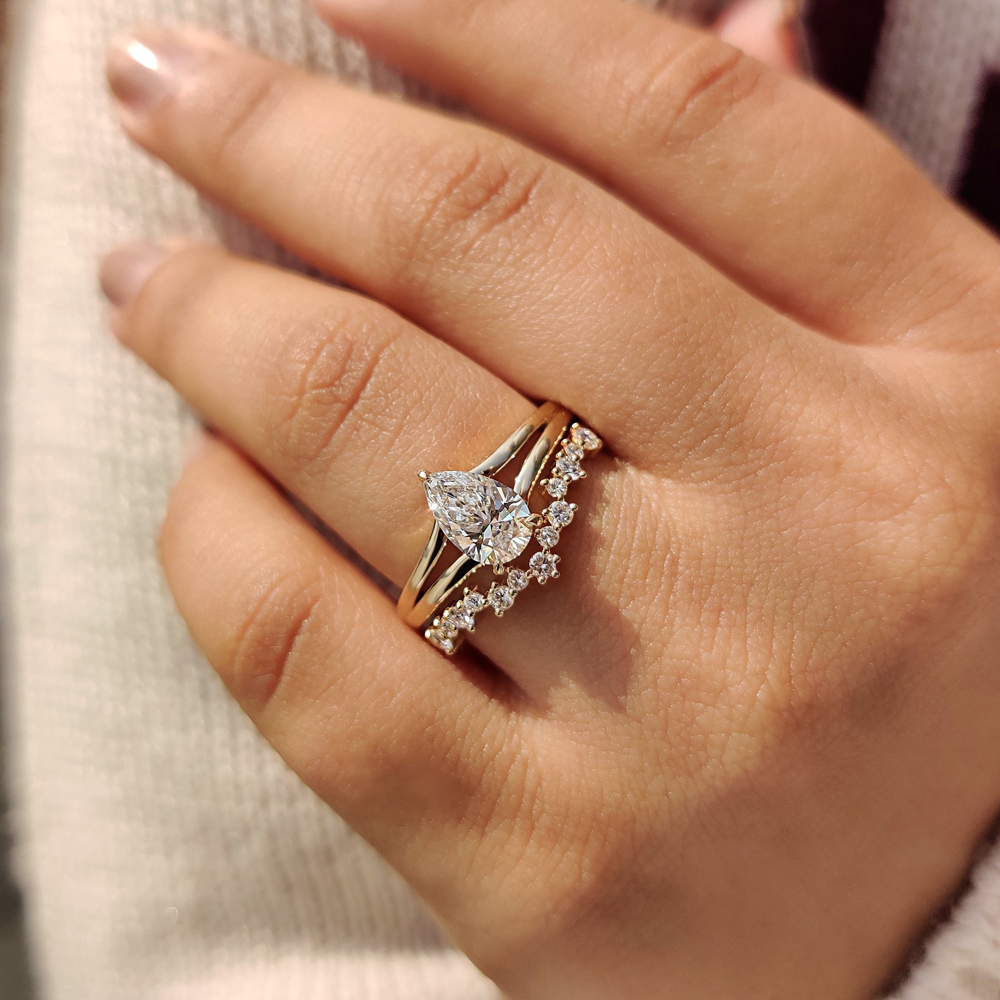 Hidden Halo Pear Shaped Ring with Curved Band