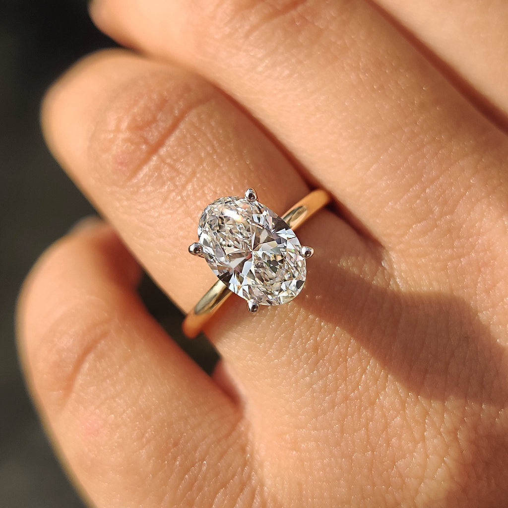 Two Tone Oval Cut Hidden Halo Engagement Ring