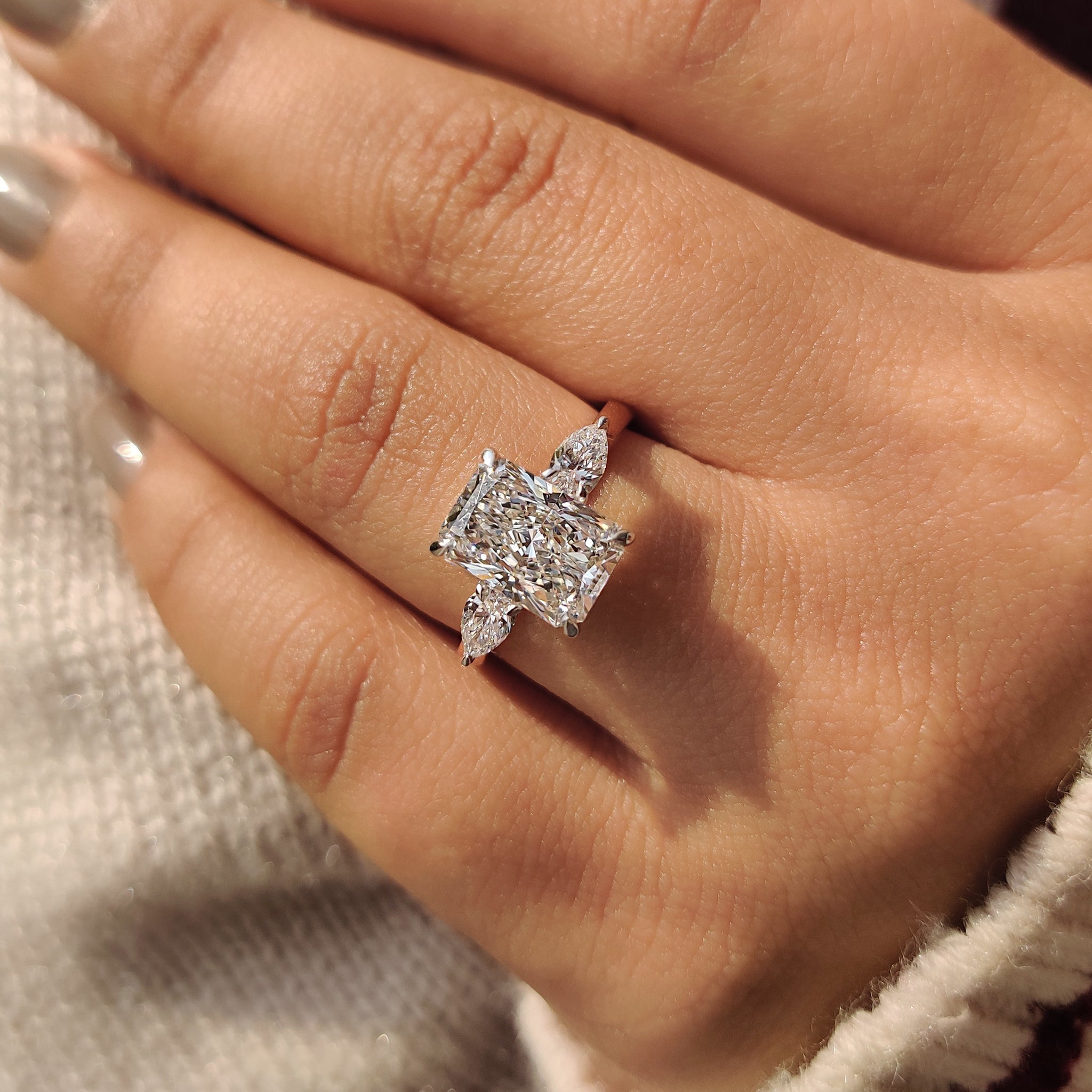 Two Tone Radiant Cut Diamond Ring With Pear Side Stones Secondary image