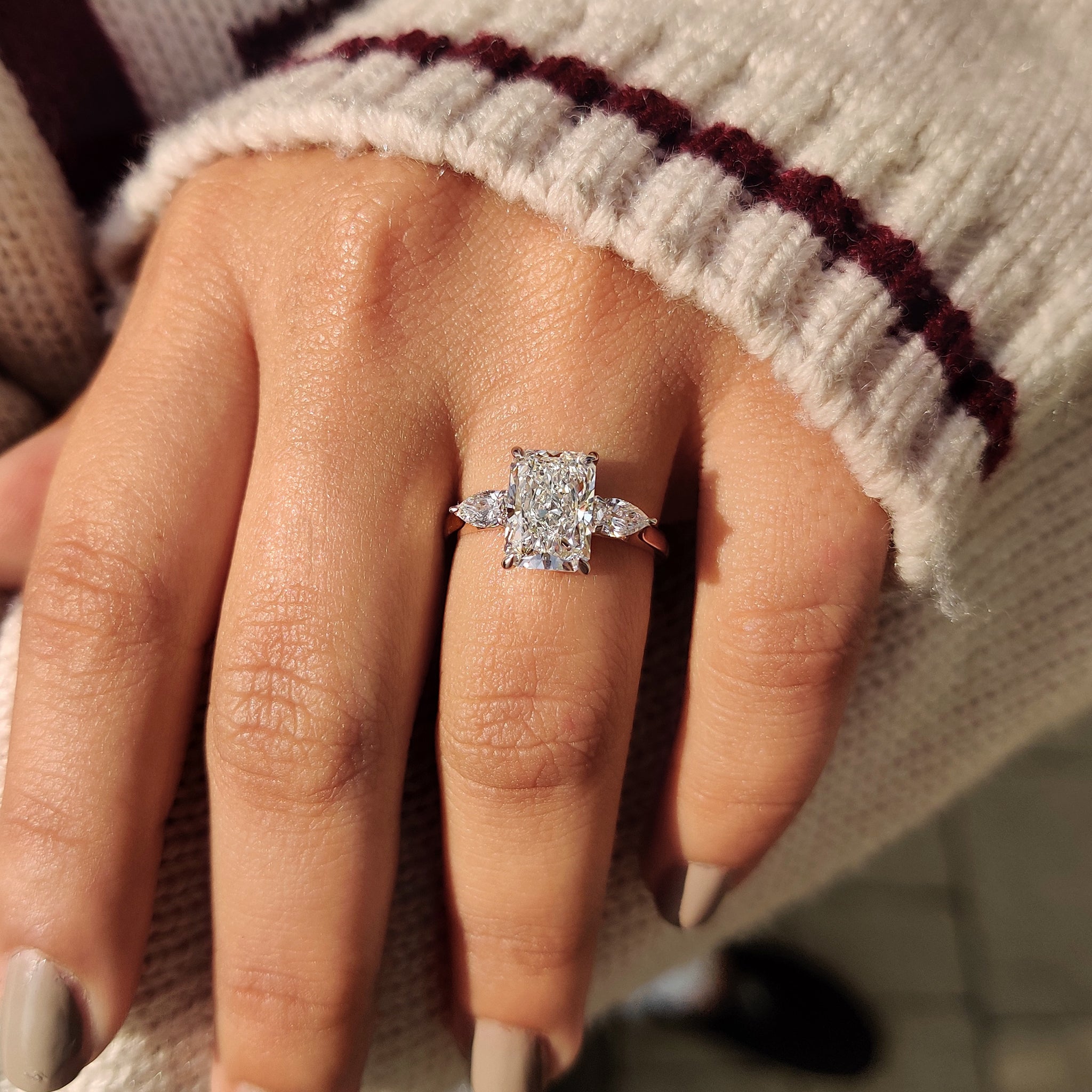 Two Tone Radiant Cut Diamond Ring With Pear Side Stones