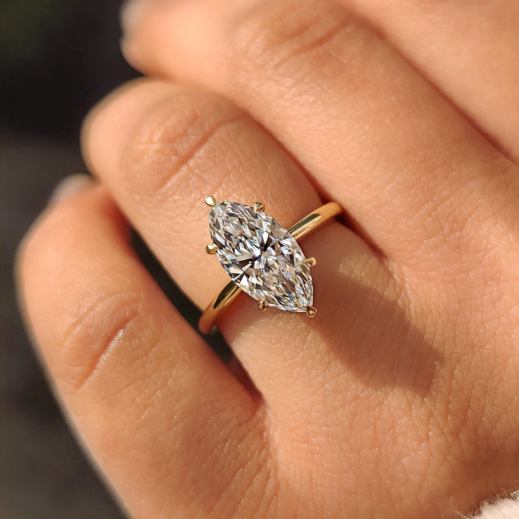 Solitaire Style Marquise Diamond Ring With Secure Claw Prong