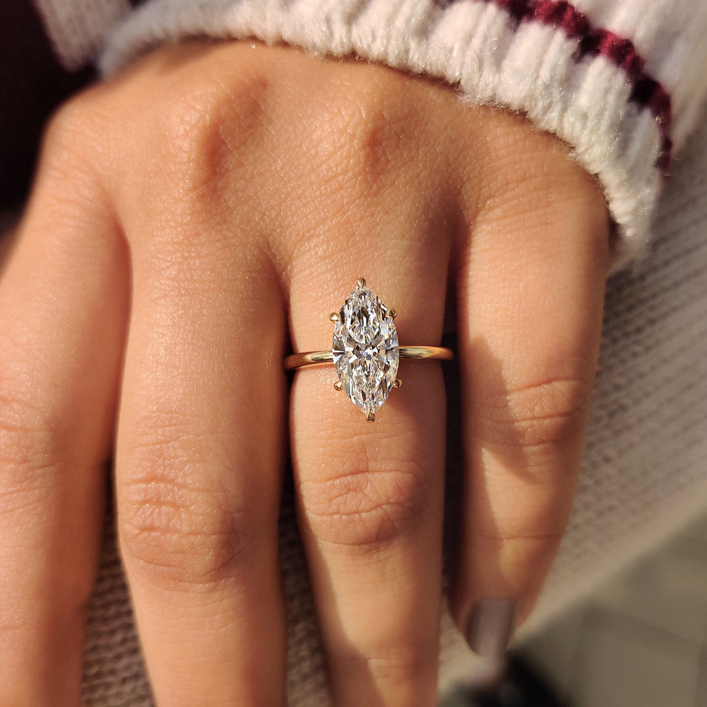Solitaire Style Marquise Diamond Ring With Secure Claw Prong