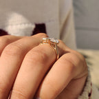 Emerald and Pear Cut Diamond Bezel Set Engagement Ring