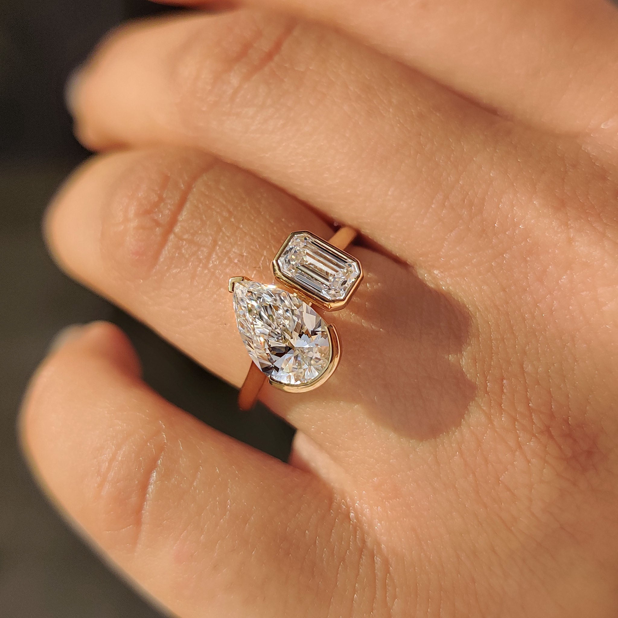 Emerald and Pear Cut Diamond Bezel Set Engagement Ring