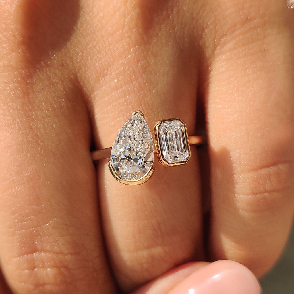 Emerald and Pear Cut Diamond Bezel Set Engagement Ring