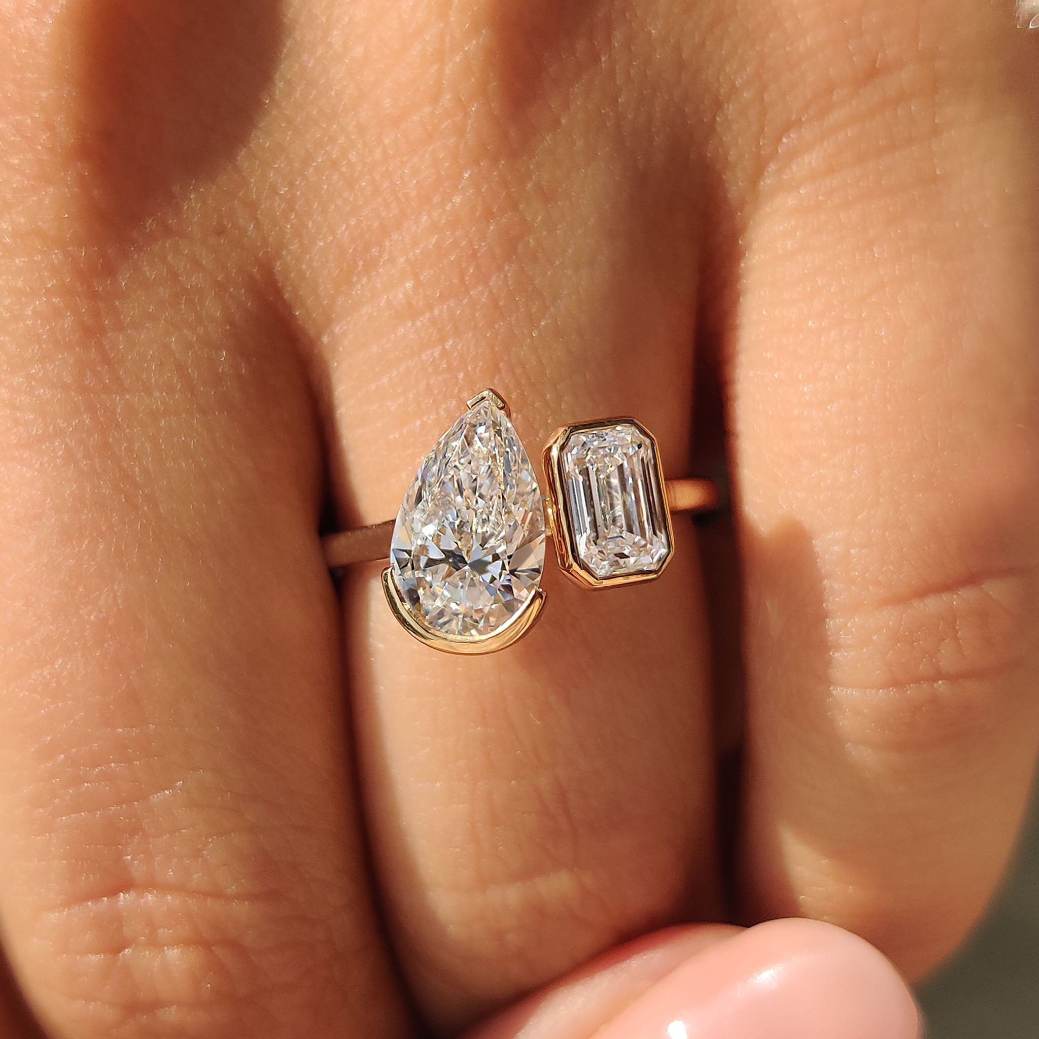 Emerald and Pear Cut Diamond Bezel Set Engagement Ring