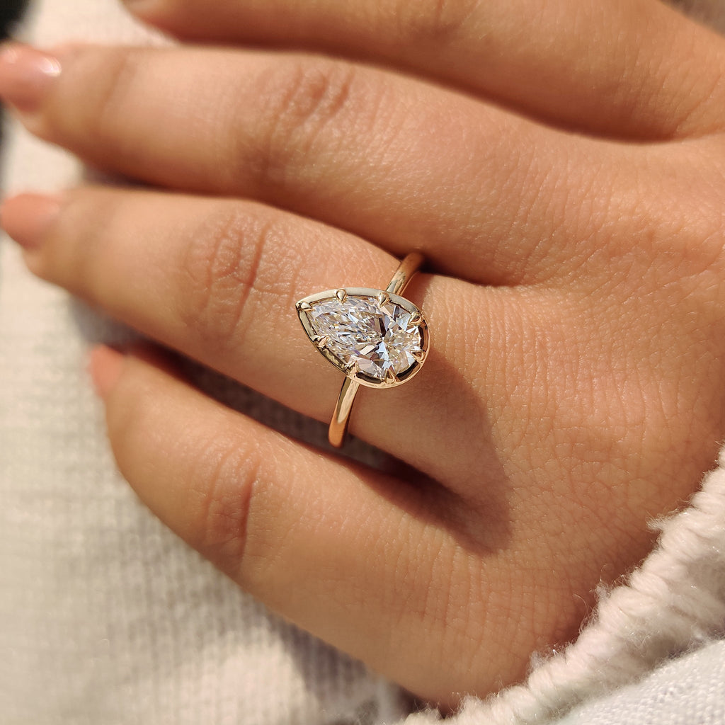 Pear Cut Diamond Ring in Bezel Type Prong Setting