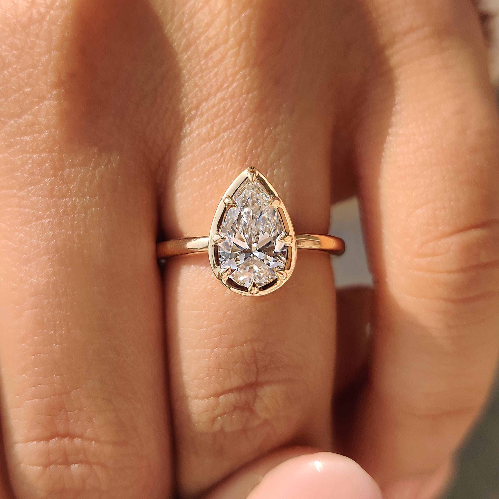 Pear Cut Diamond Ring in Bezel Type Prong Setting