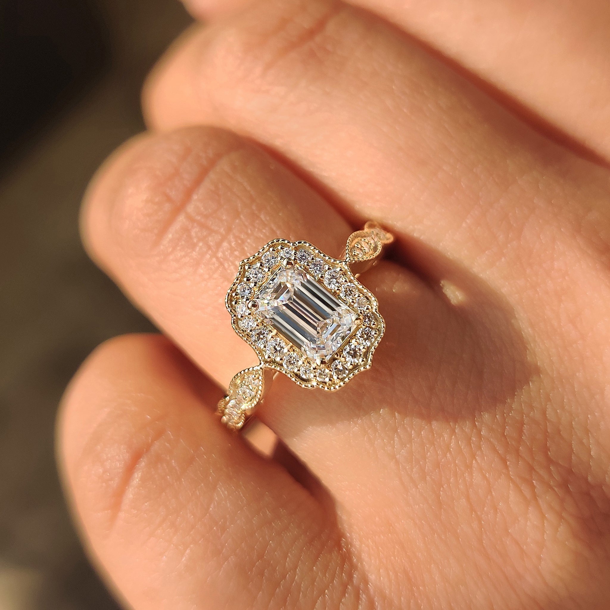 Emerald Cut Diamond Ring in Round Diamond Halo Style
