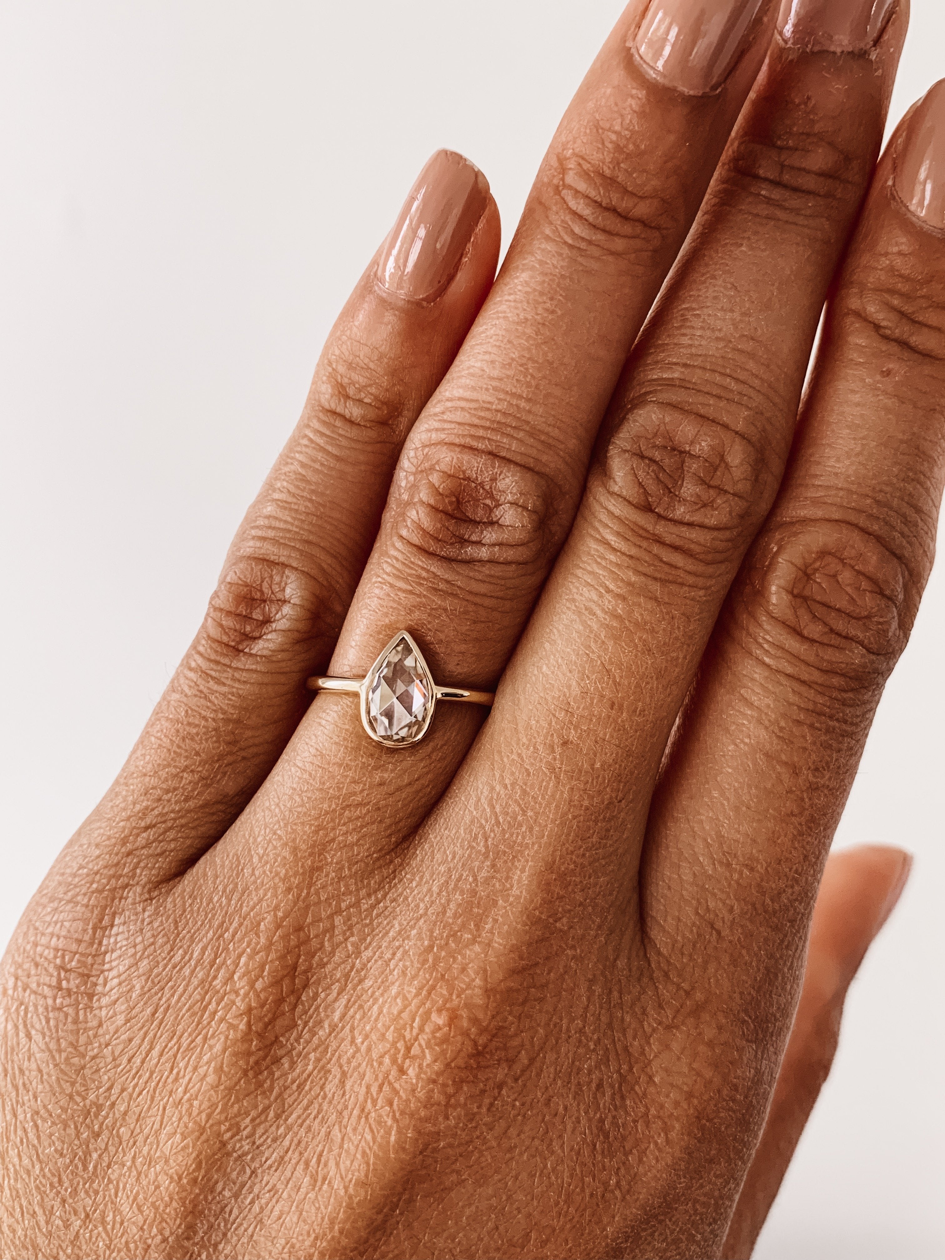 0.80 CT Pear Cut Moissanite Bezel Style Engagement Ring