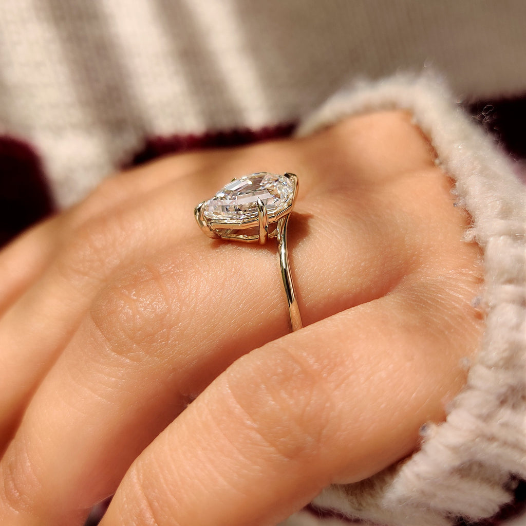 Pear Step Cut Diamond Solitaire Engagement Ring in Bypass Setting