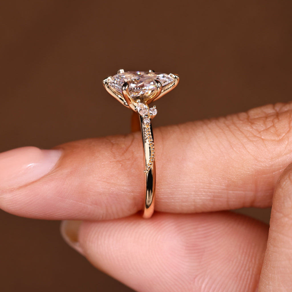 Pear Cut Engagement Ring With Side Stone In Vintage Style