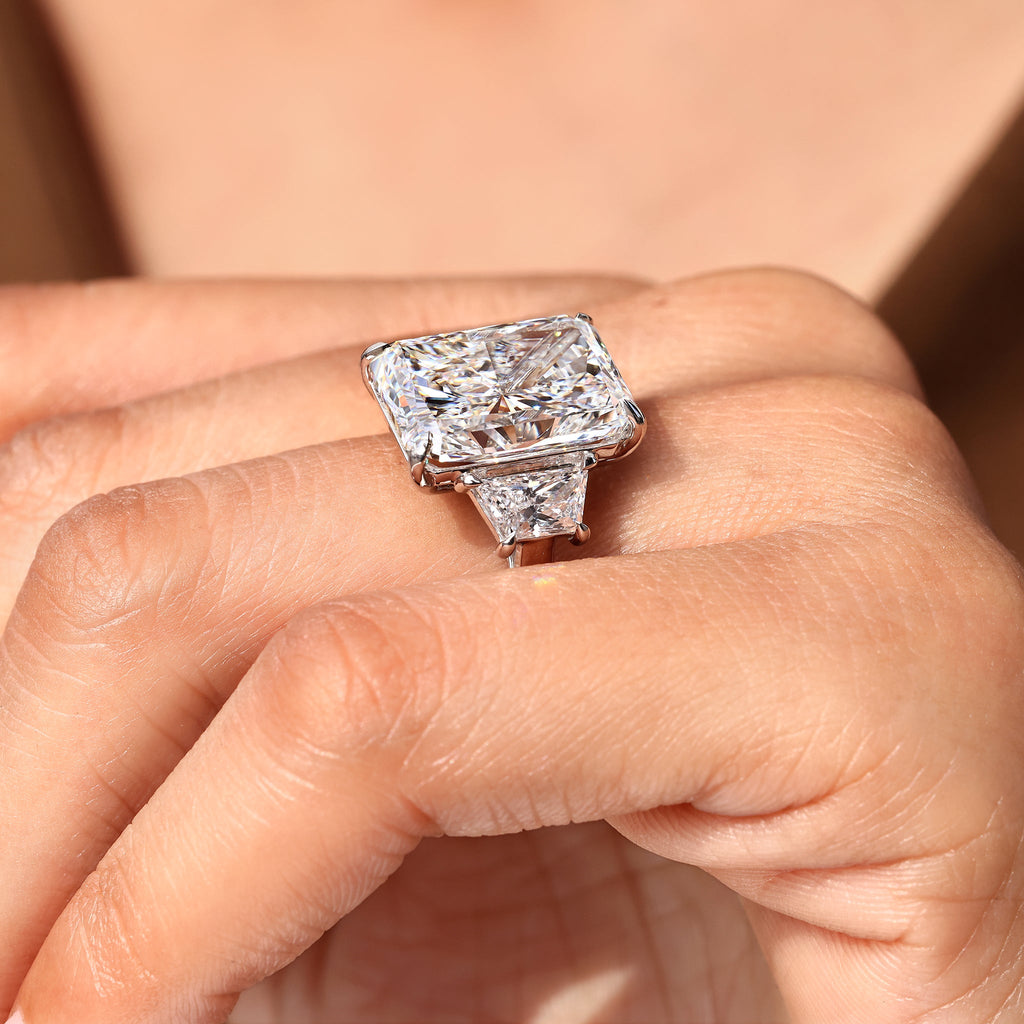 10 - 14 Carat Radiant Cut Diamond Ring with Trapezoid Side Stones