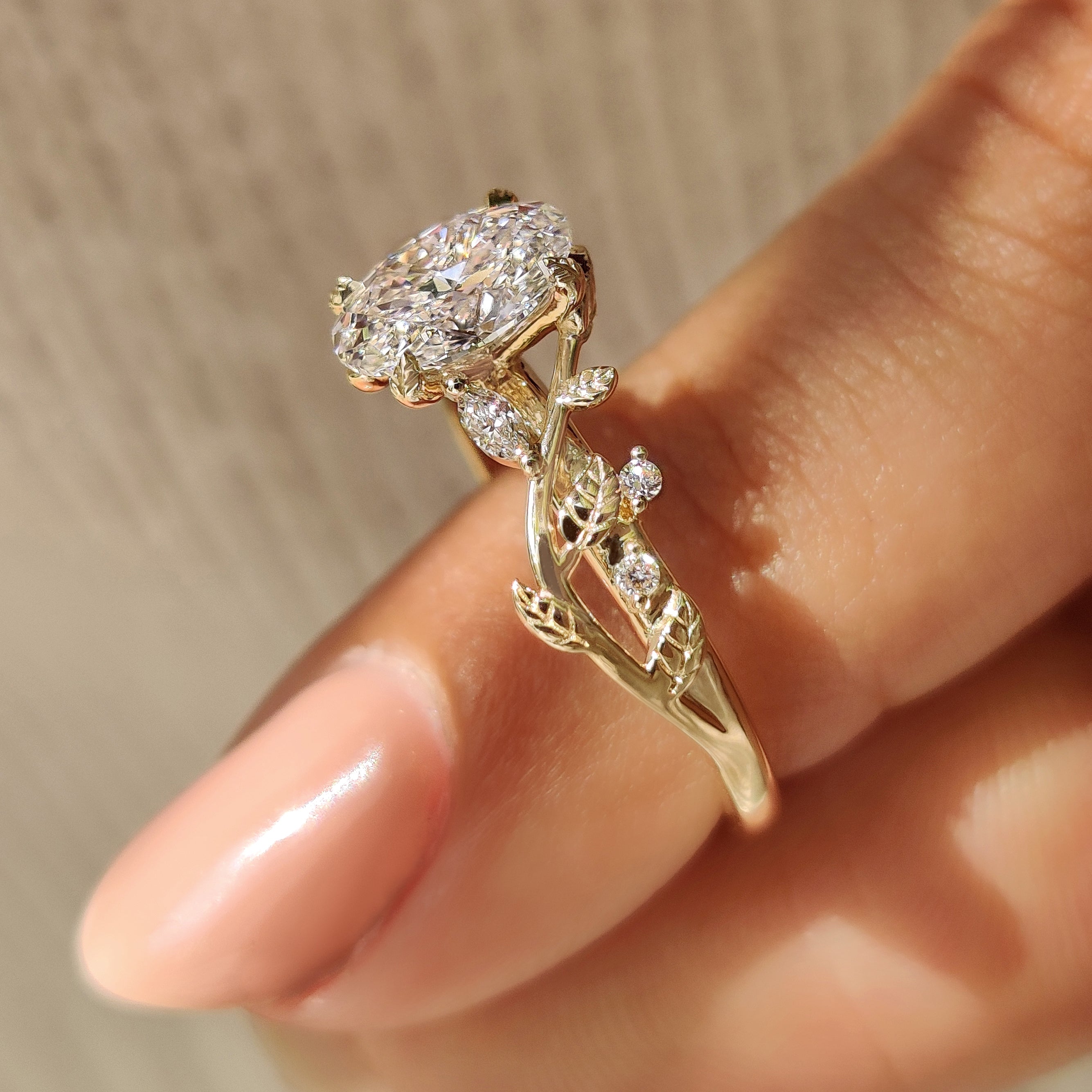 Nature Inspired Oval Diamond Ring with Leaf Style Prong Setting
