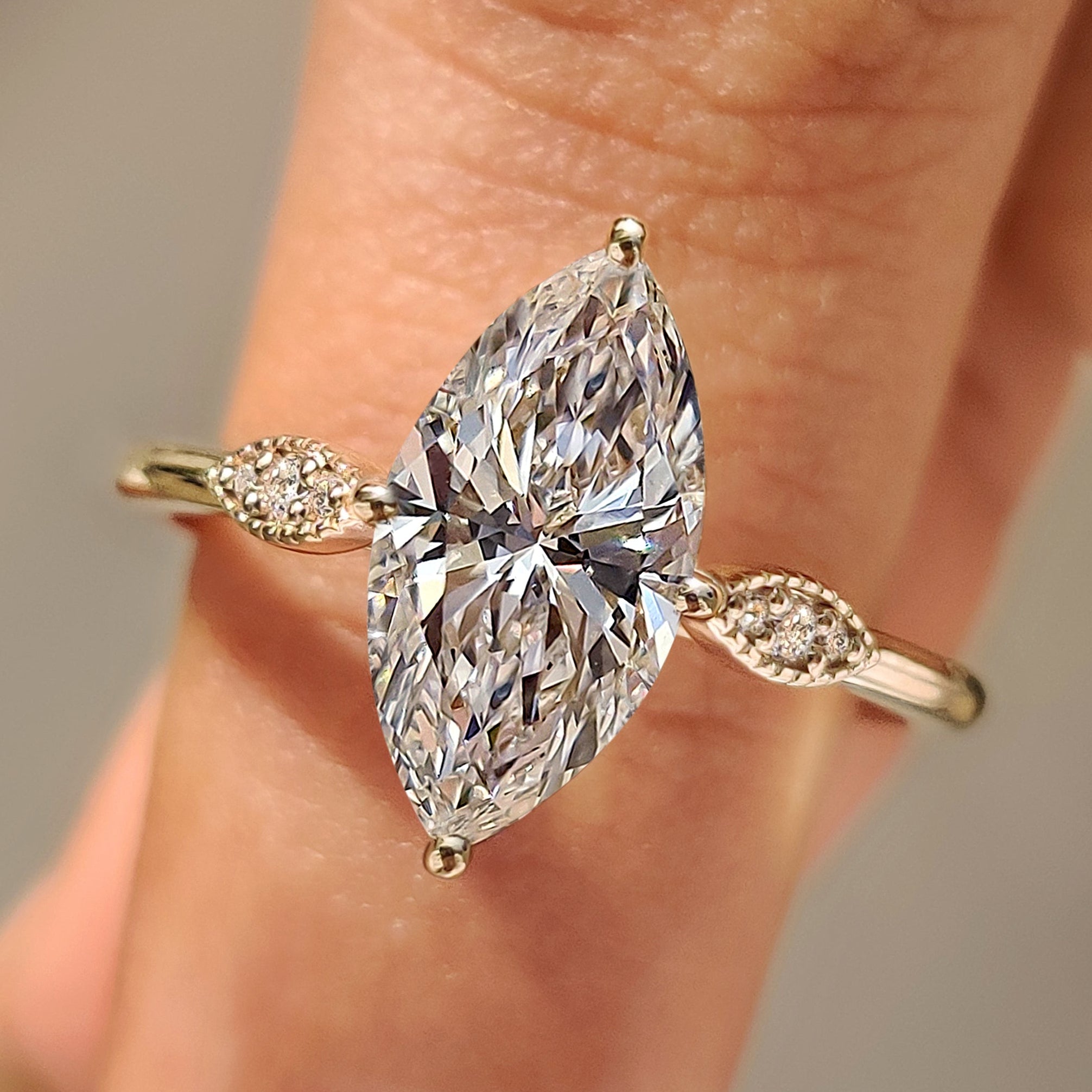 Marquise Cut Diamond Ring with Round Side Stones Main image