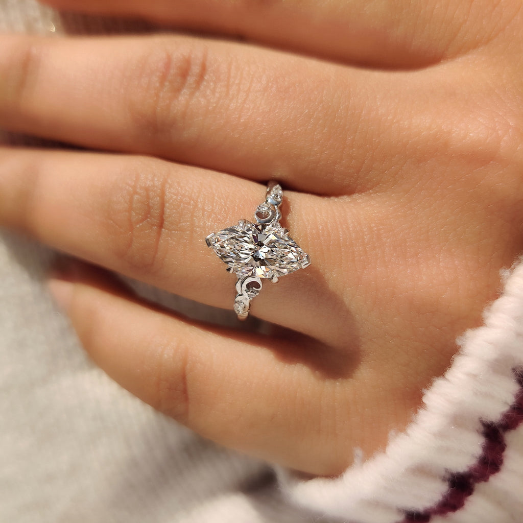 Marquise Cut Diamond Ring in Side Stone Style