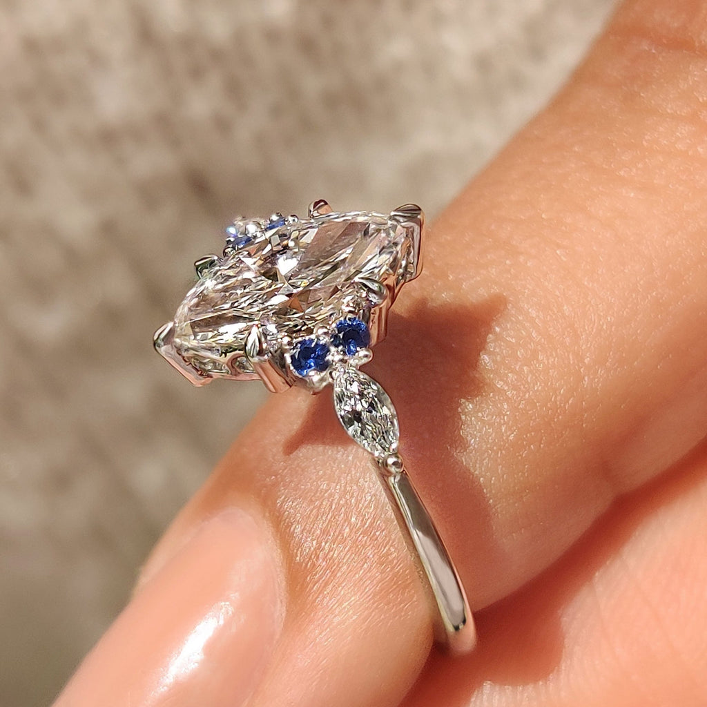 Marquise Cut Engagement Ring With Blue Sapphire Side Stone Style