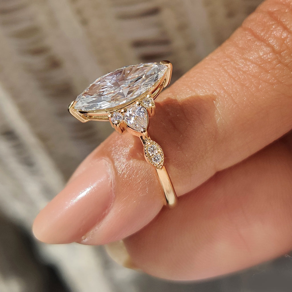 Marquise Cut Ring with Pear and Round Side Stones