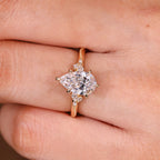 Pear Cut Engagement Ring With Side Stone In Vintage Style