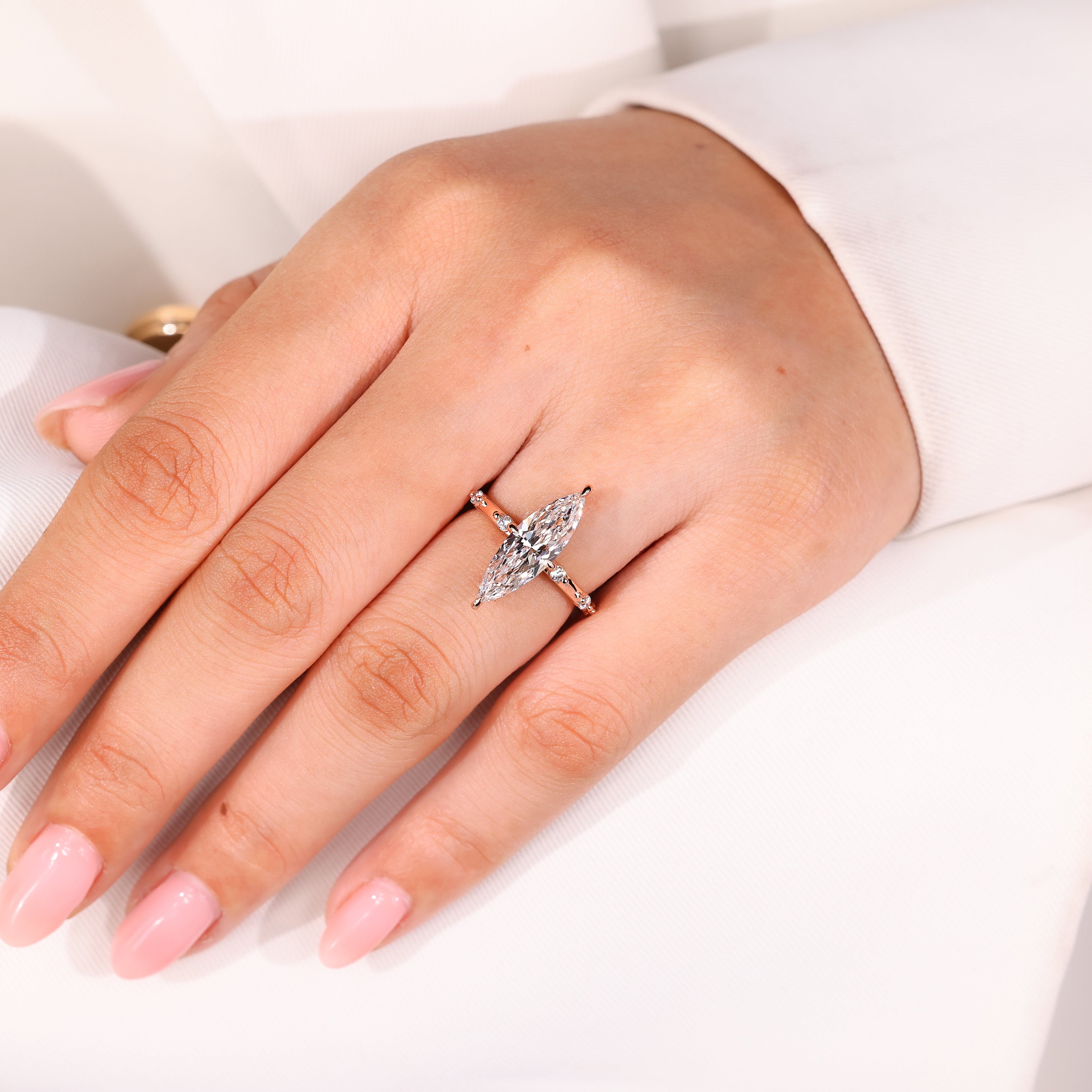 Elongated Marquise Engagement Ring In Distance Pave Style