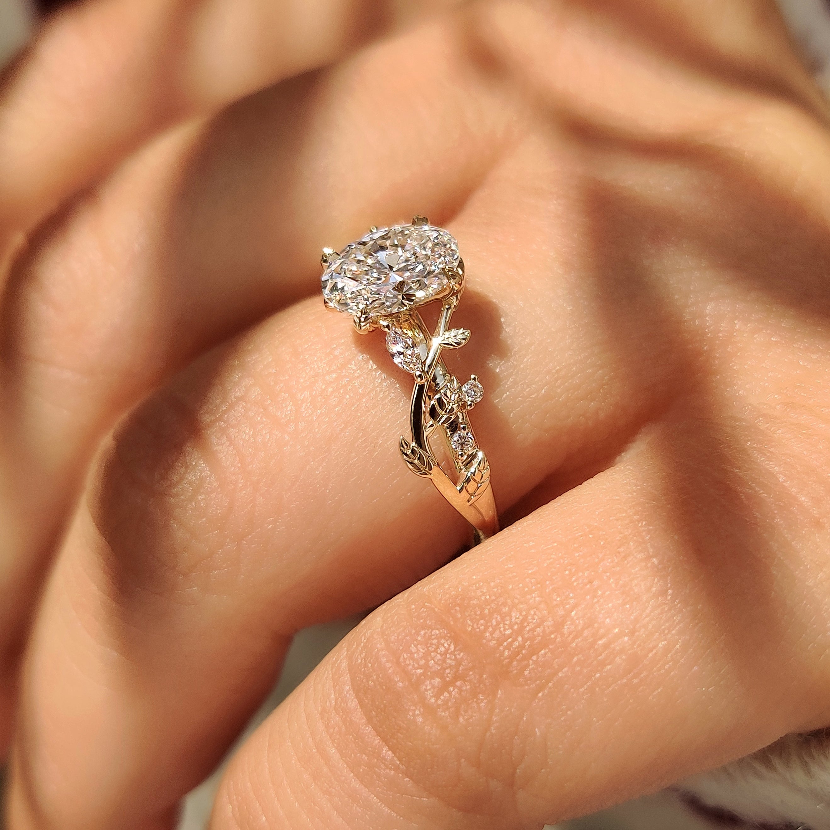 Nature Inspired Oval Diamond Ring with Leaf Style Prong Setting
