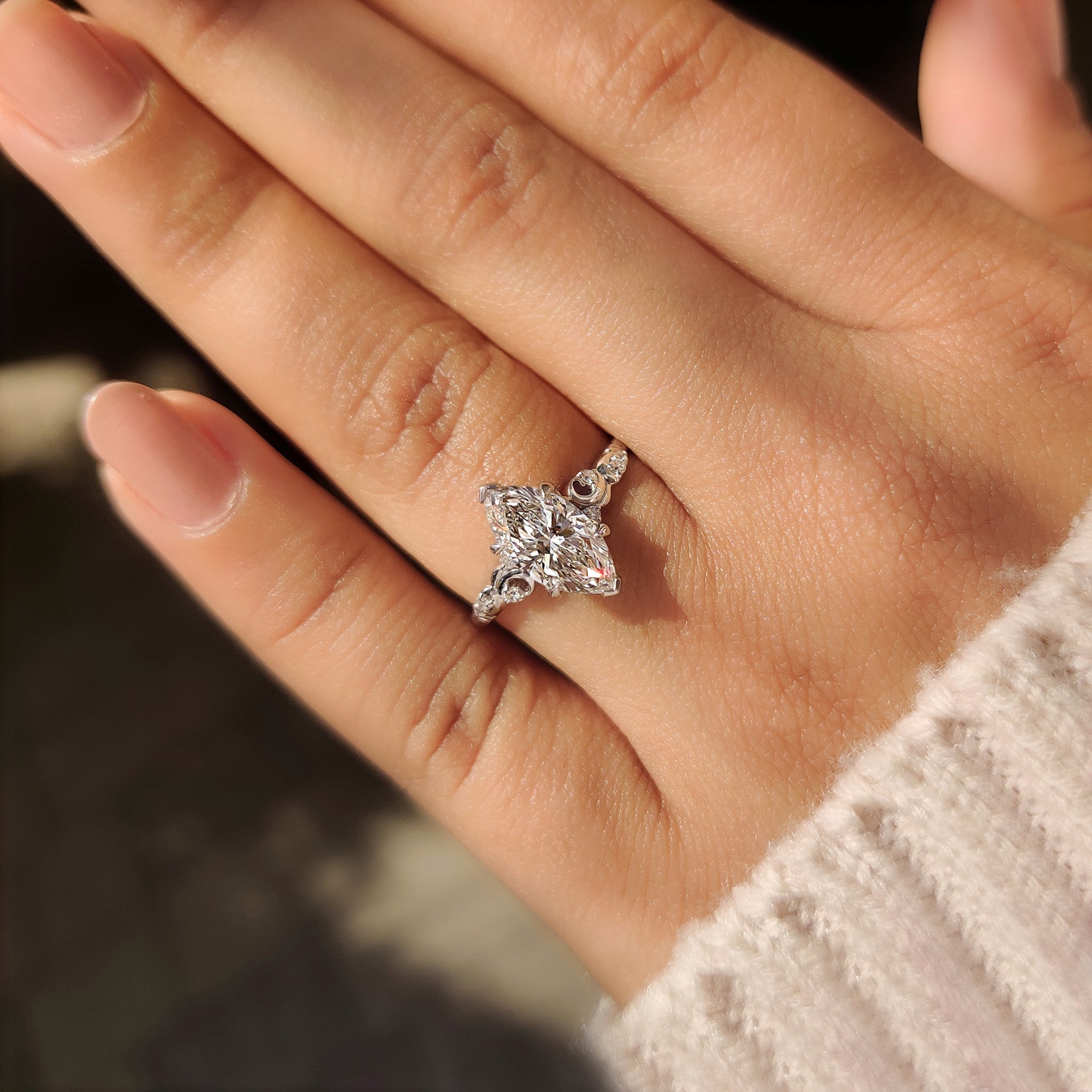 Marquise Cut Diamond Ring in Side Stone Style