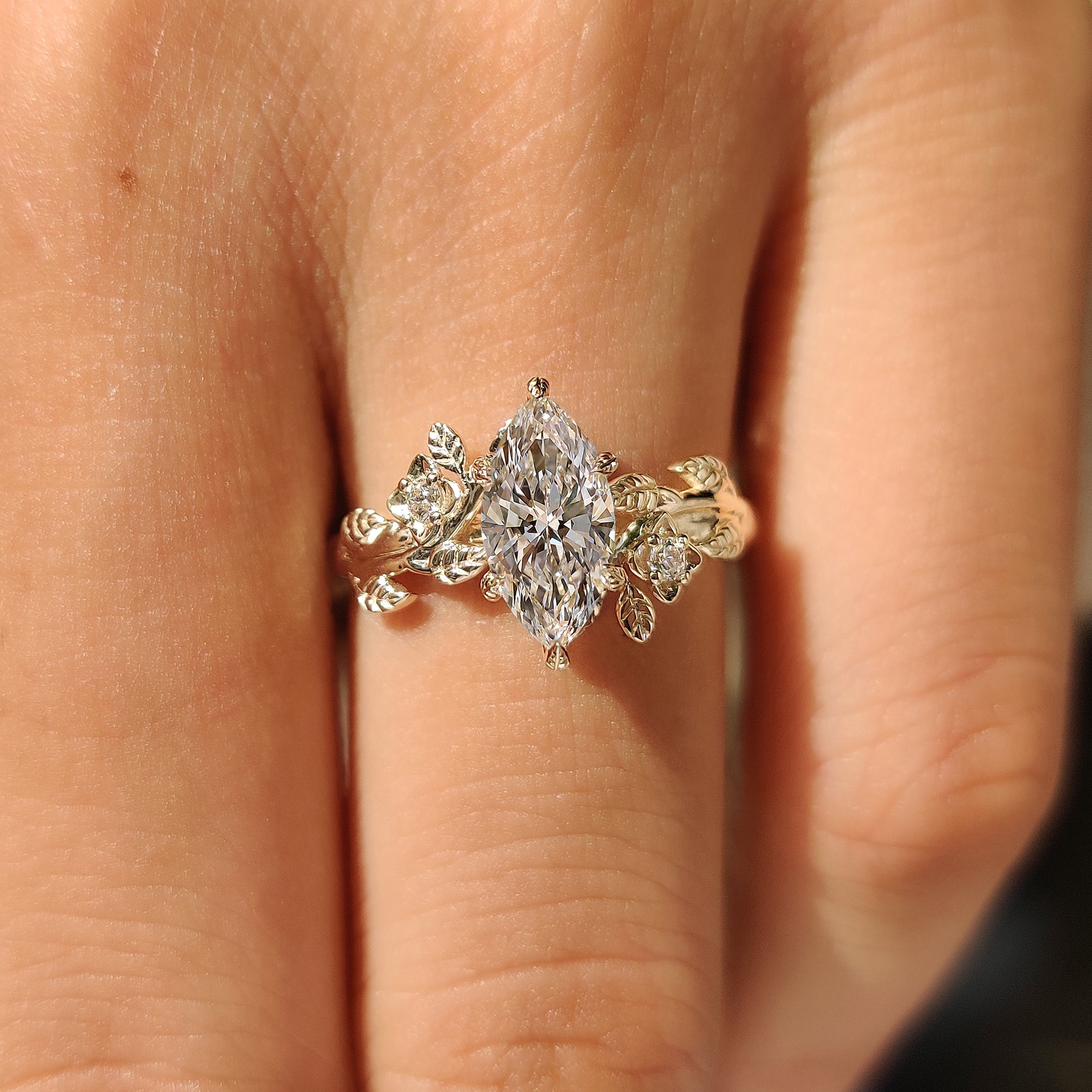 Nature Inspired Marquise Cut Engagement Ring with Round Side Stone