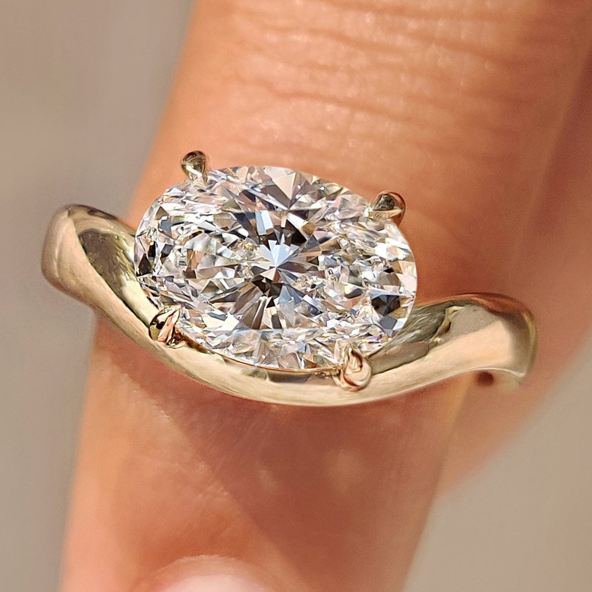 Solitaire Oval Cut Diamond Ring in East to West Setting Main image