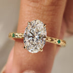 Oval Cut Art Deco Diamond Ring with Two Emerald Side Gemstones