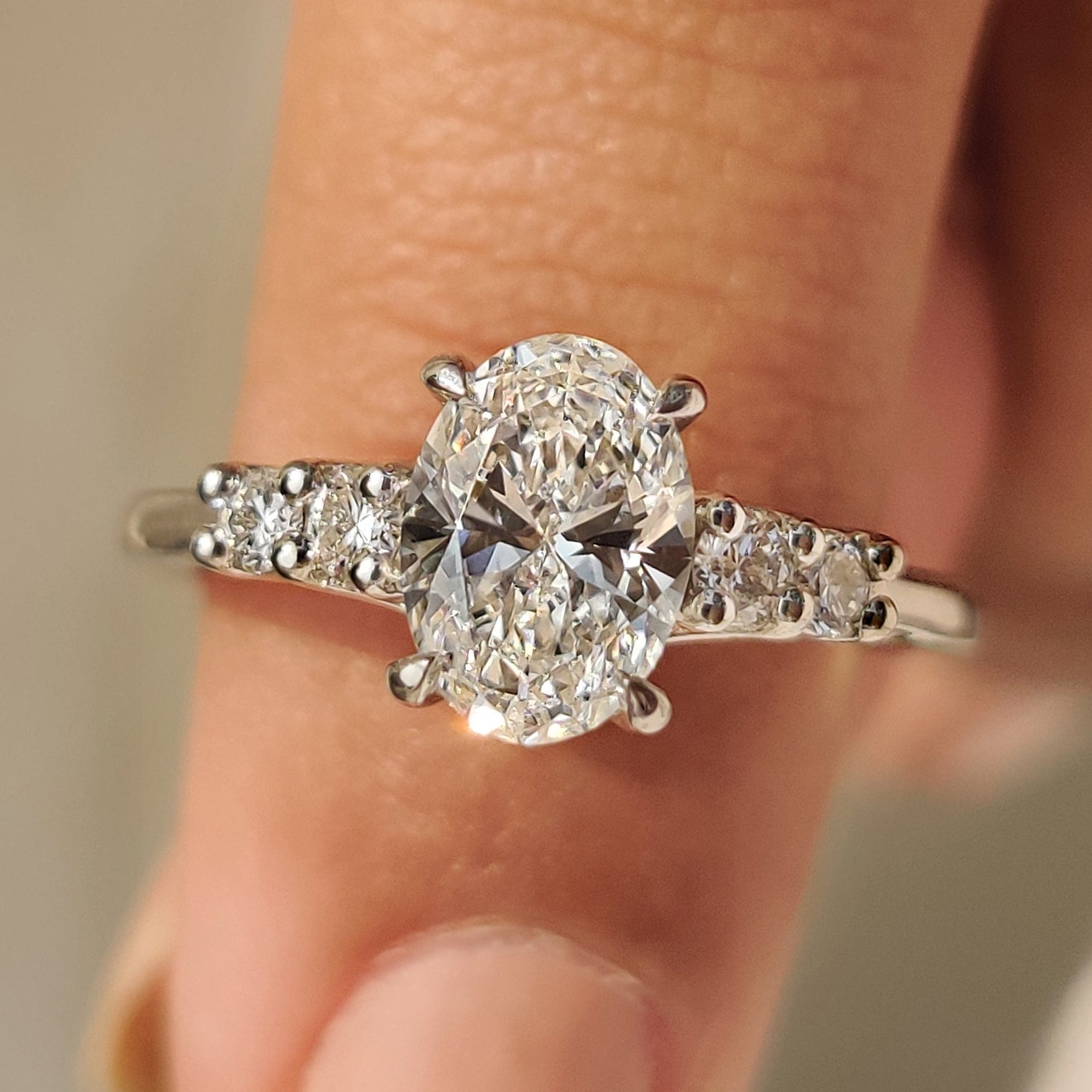 Oval Cut Diamond Ring with Round Side Stones Main image