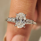 Oval Cut Diamond Ring with Round Side Stones