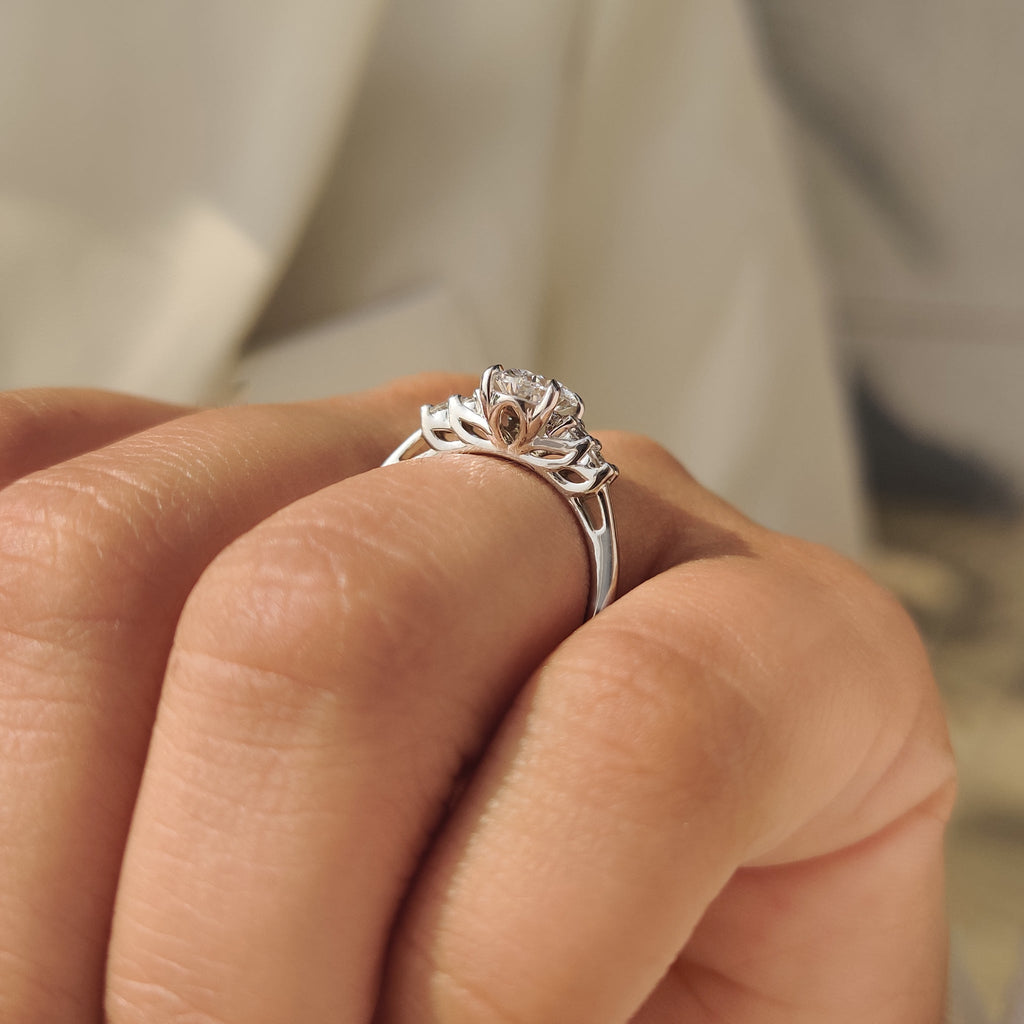 Oval Cut Diamond Ring with Round Side Stones
