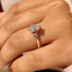Three Stone Style Oval Cut Engagement Ring with Round Side Stone