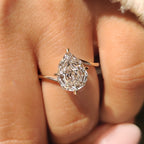 Pear Step Cut Diamond Solitaire Engagement Ring in Bypass Setting