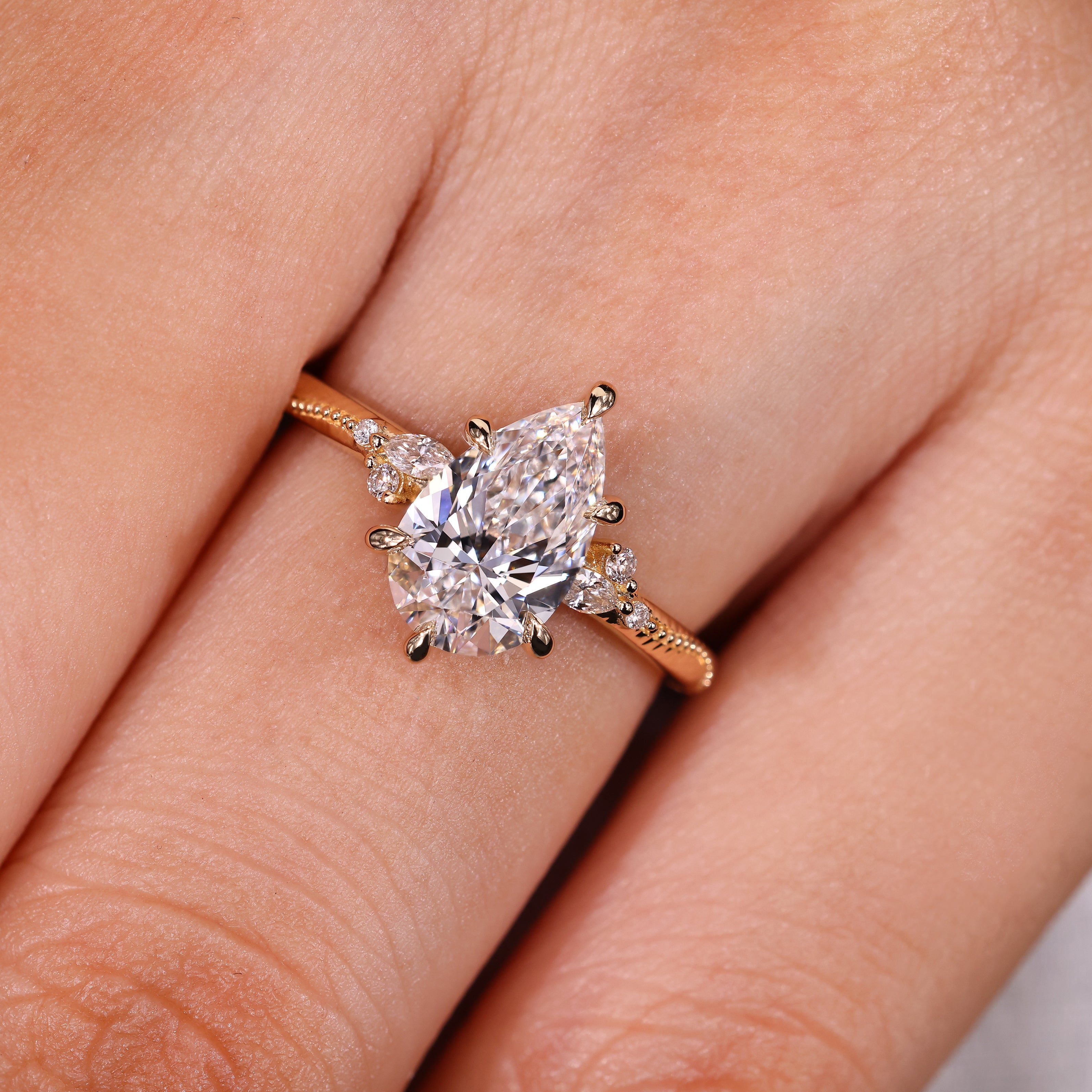 Pear Cut Engagement Ring With Side Stone In Vintage Style