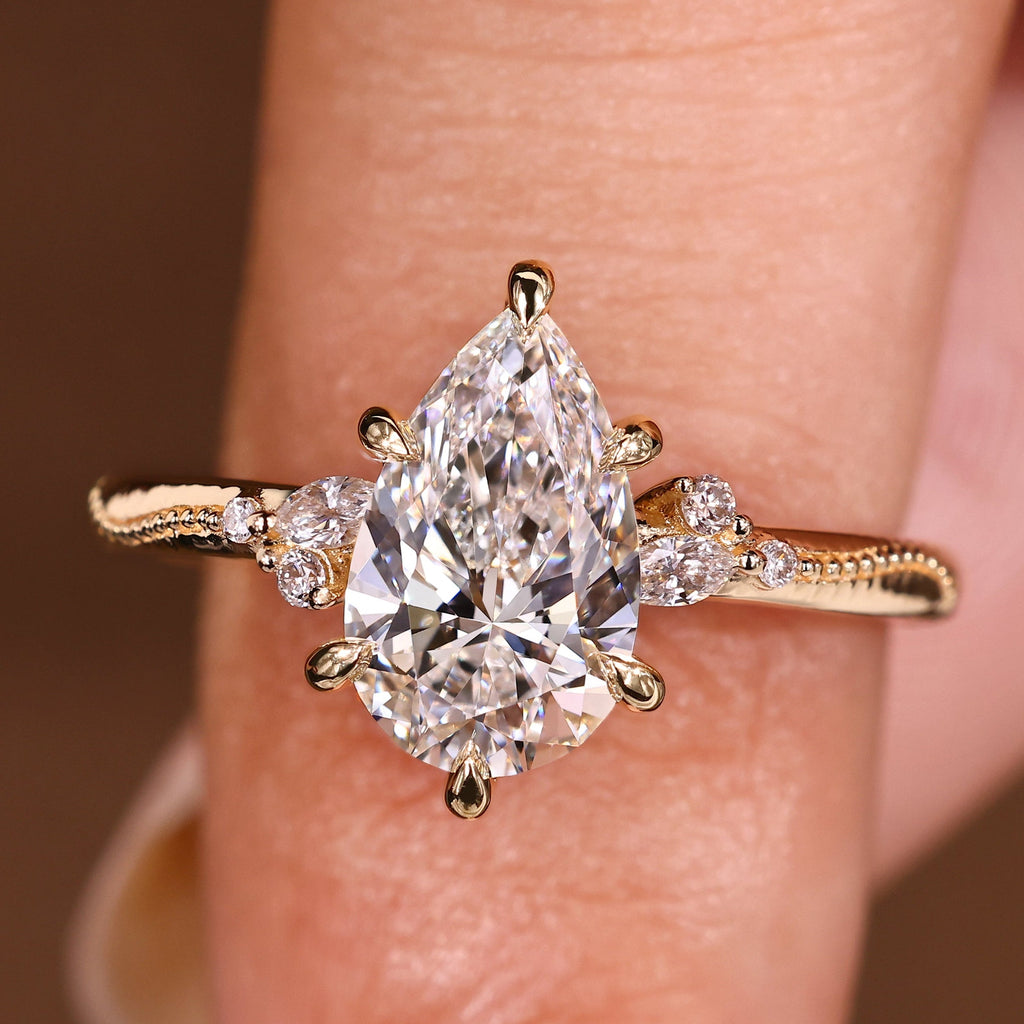 Pear Cut Engagement Ring With Side Stone In Vintage Style
