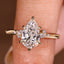 Pear Cut Engagement Ring With Side Stone In Vintage Style