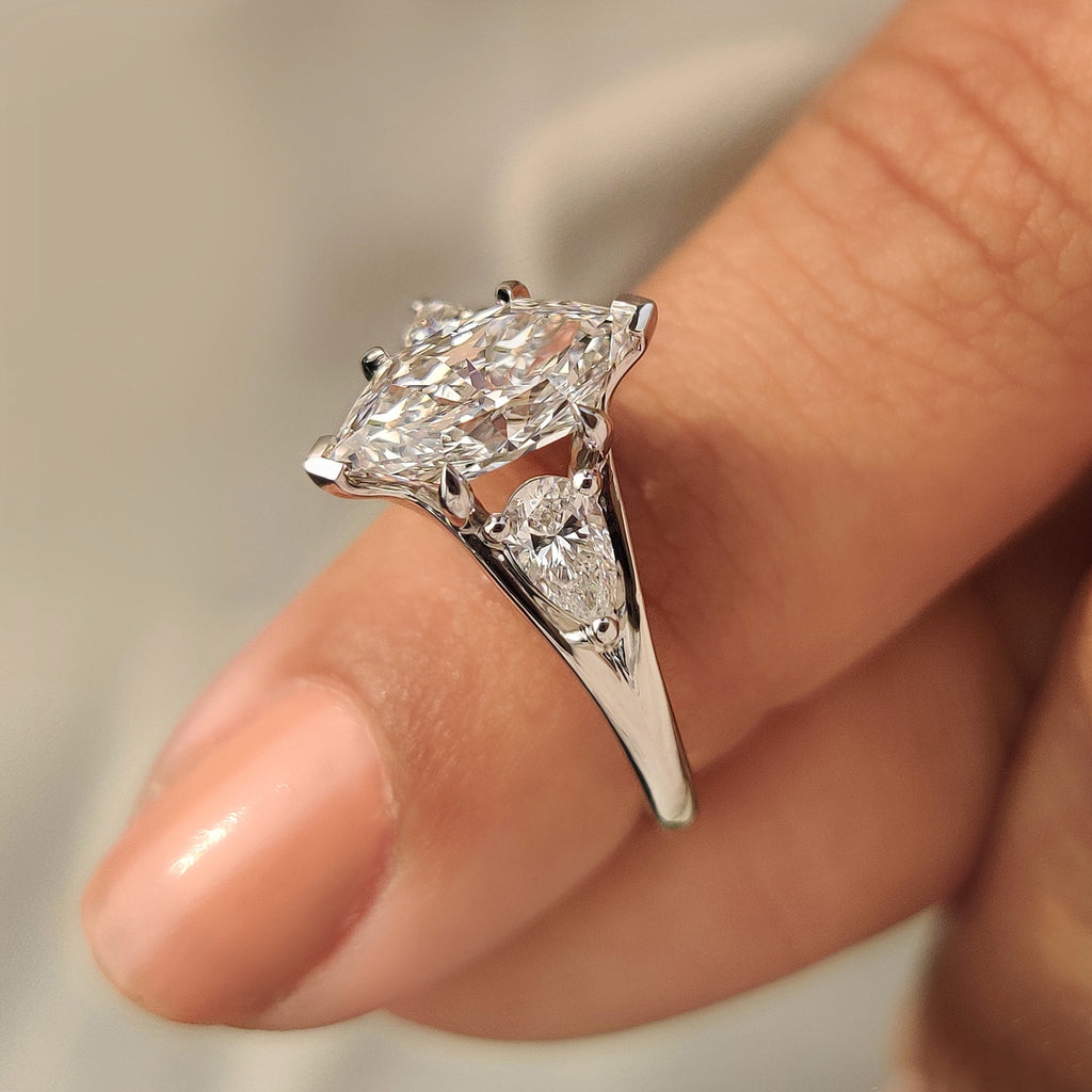 Three Stone Style Dutch Marquise Diamond Ring With Pear Side Stone