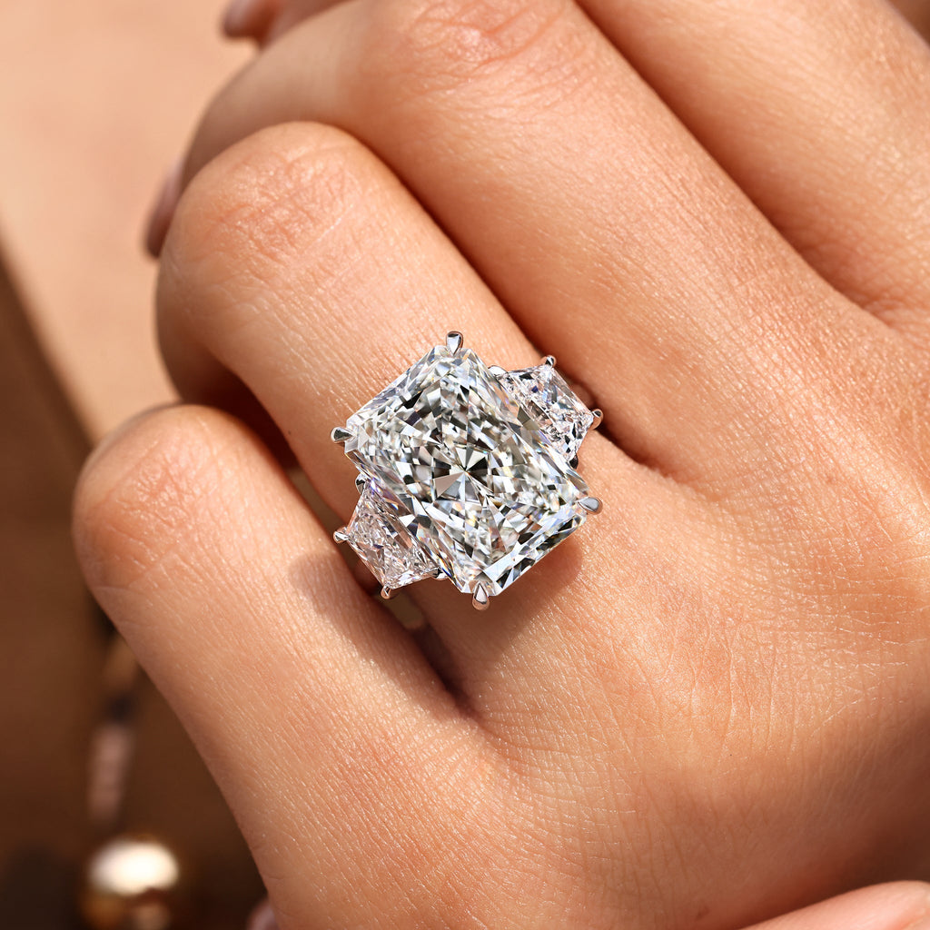 10 - 14 Carat Radiant Cut Diamond Ring with Trapezoid Side Stones