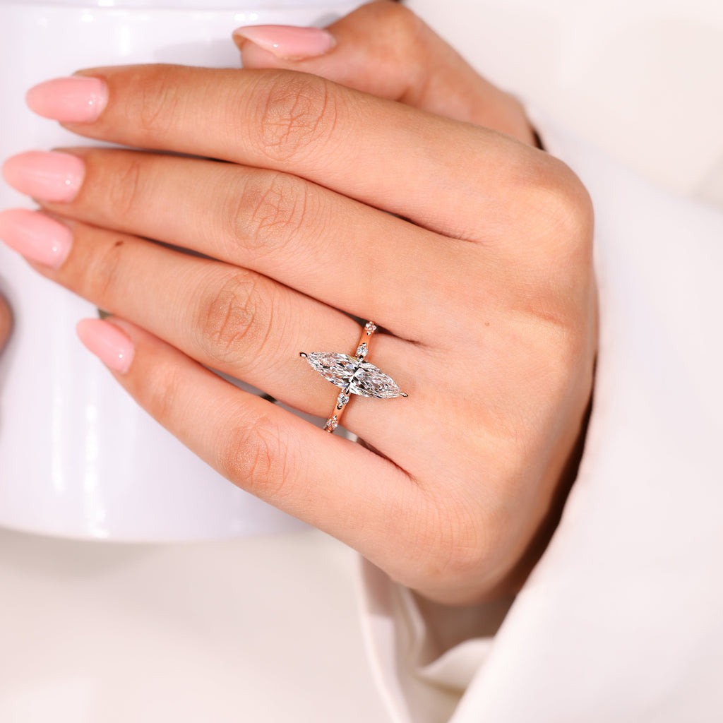 Elongated Marquise Engagement Ring In Distance Pave Style