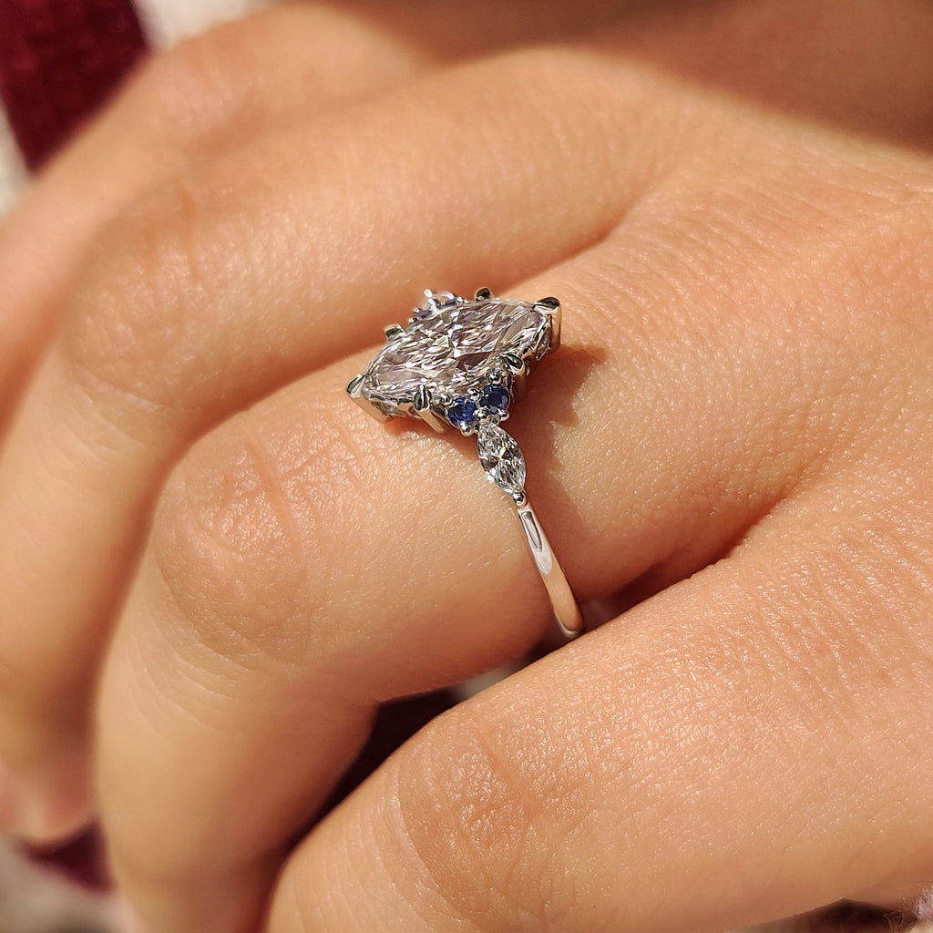 Marquise Cut Engagement Ring With Blue Sapphire Side Stone Style