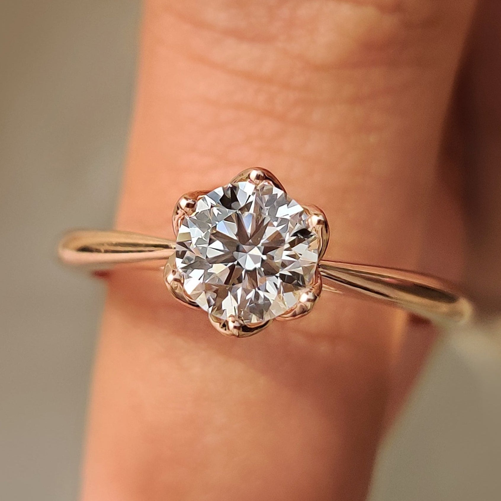 Solitaire Style Round Cut Diamond Ring with Hidden Blue Sapphire Main image