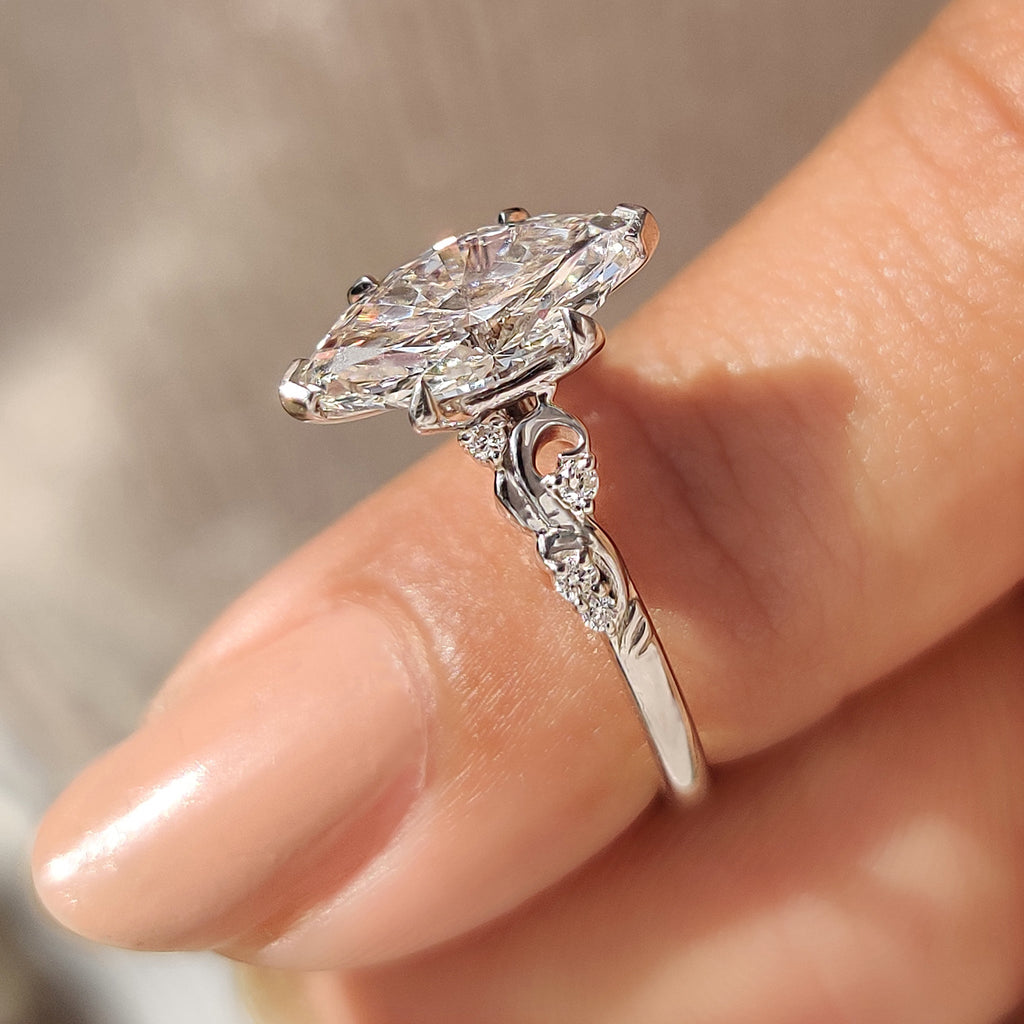Marquise Cut Diamond Ring in Side Stone Style